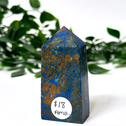 Azurite crystal tower with price tag on white leafy background