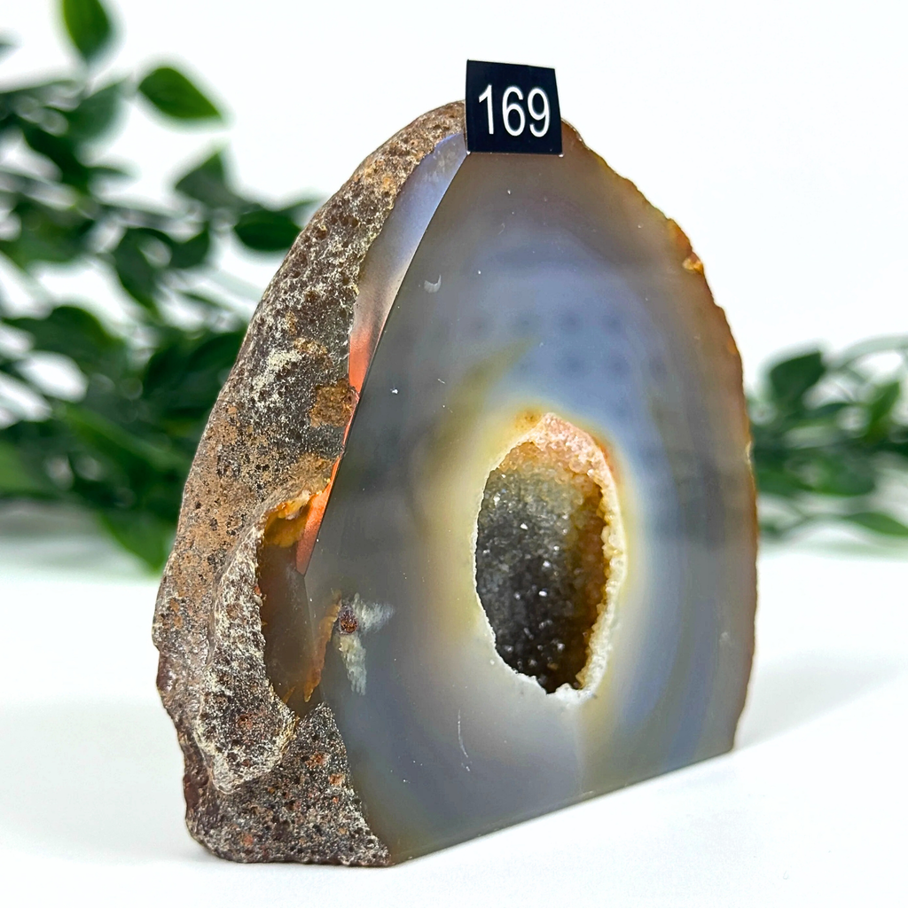 Agate geode with blue and grey interior on a white background