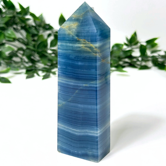Blue onyx crystal tower with a white background