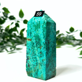 Chrysocolla tower with a tag labeled '59' against a white background with green leaves.
