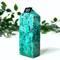 Chrysocolla tower with a number '60' tag against a green leafy background