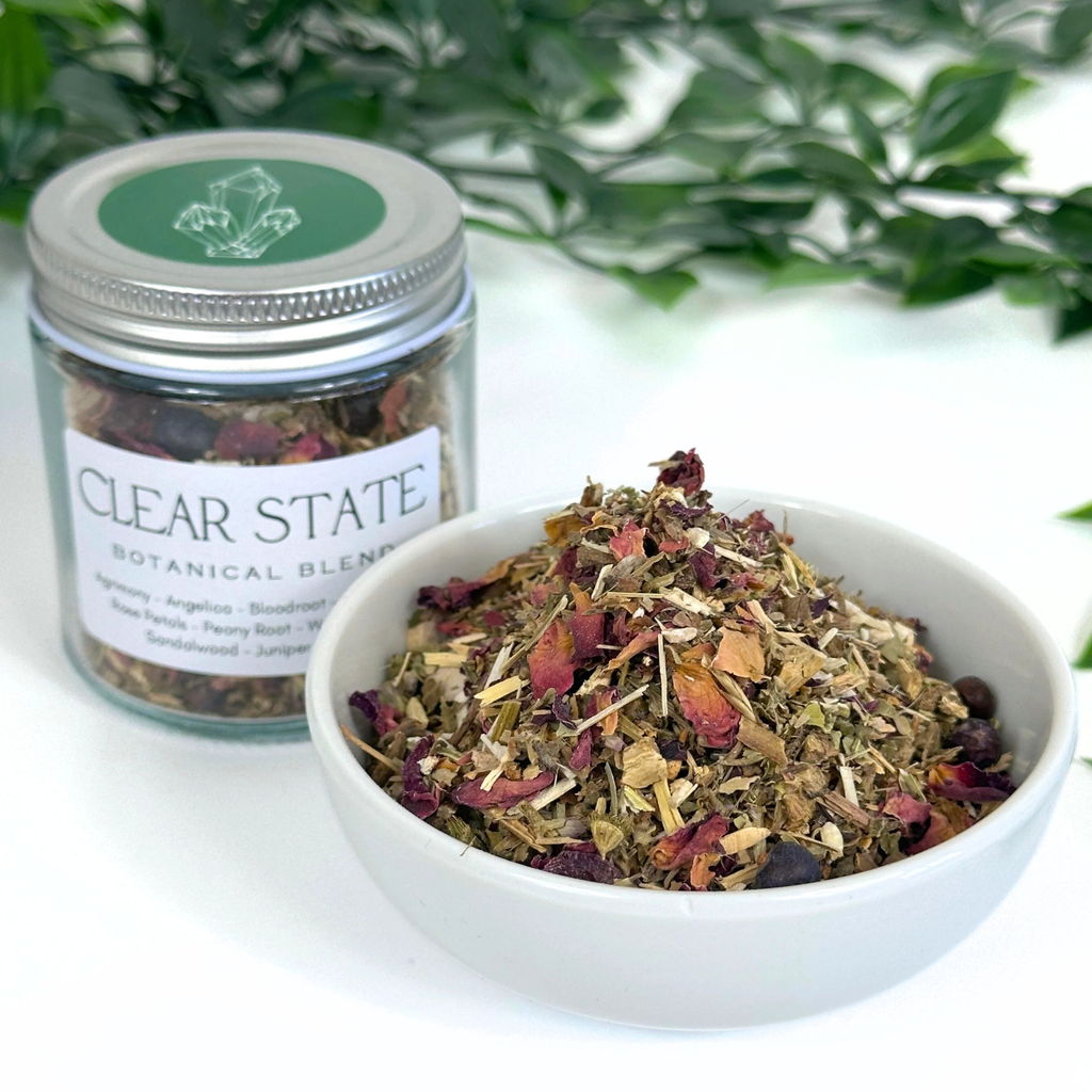 Clear State botanical blend jar with a bowl of dried herbs on a white background