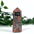 Feldspar crystal tower on a white background