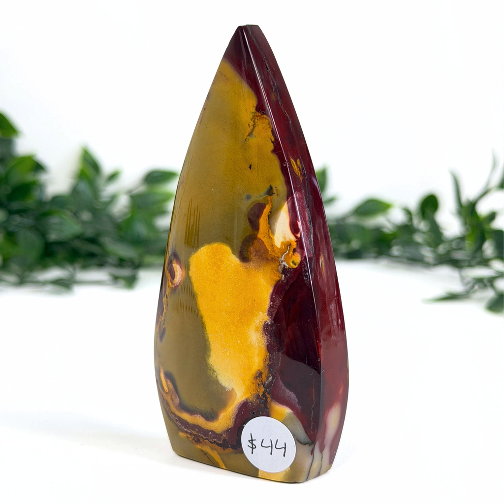 Marbled mookaite crystal teardrop with a price tag on a white background