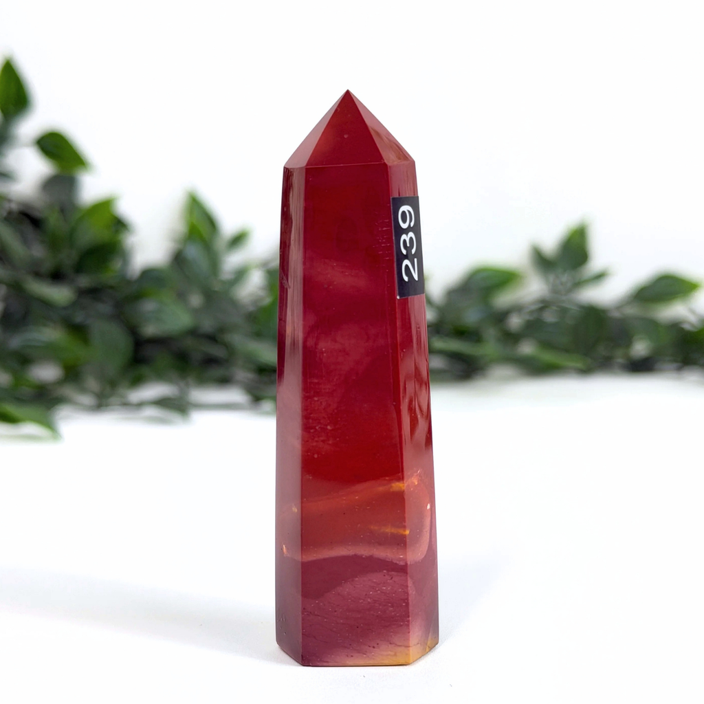 Red mookaite crystal tower with number 239 on a white background