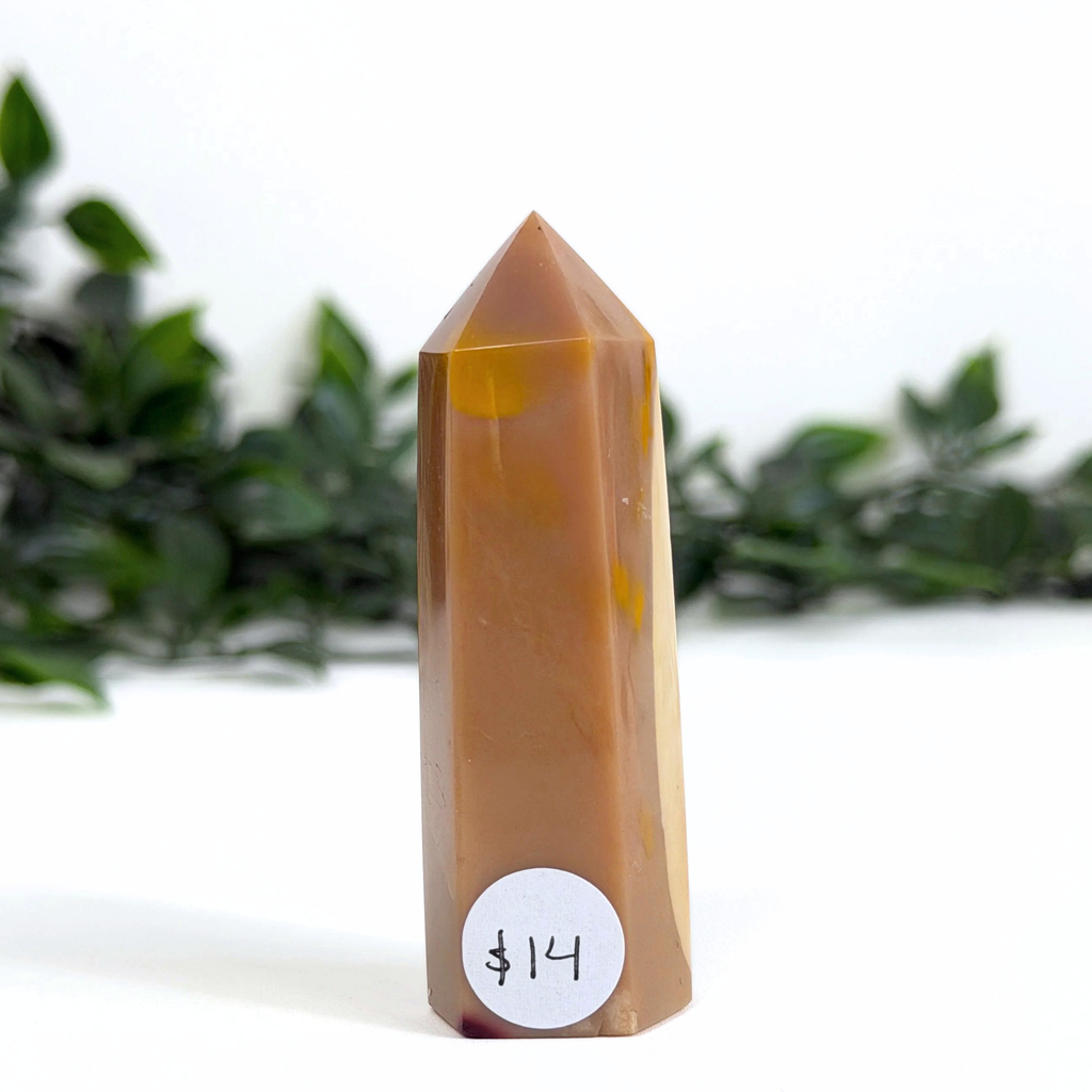 Brown mookaite crystal tower with a price tag on a white background