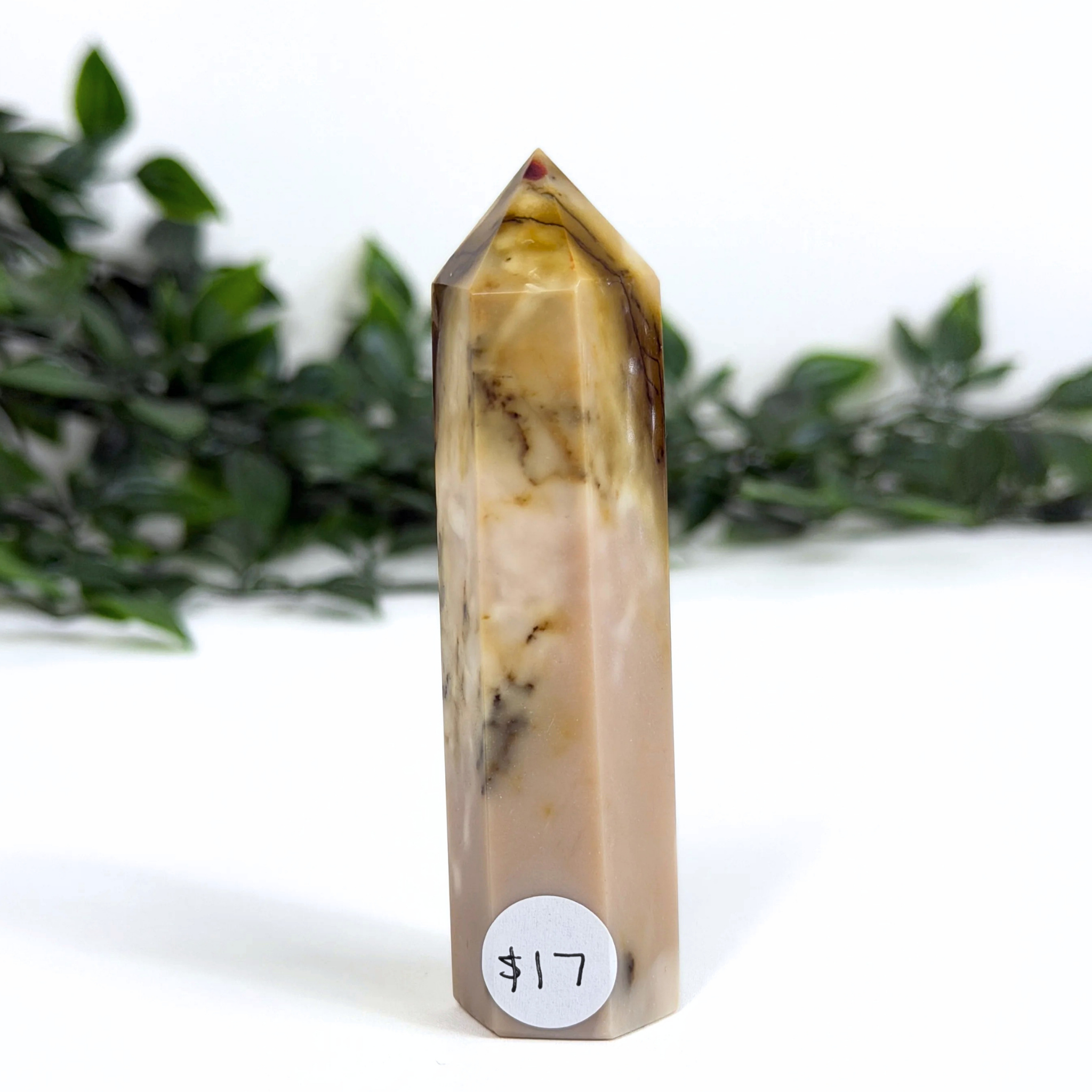 Mookaite crystal tower with a price tag on a white background