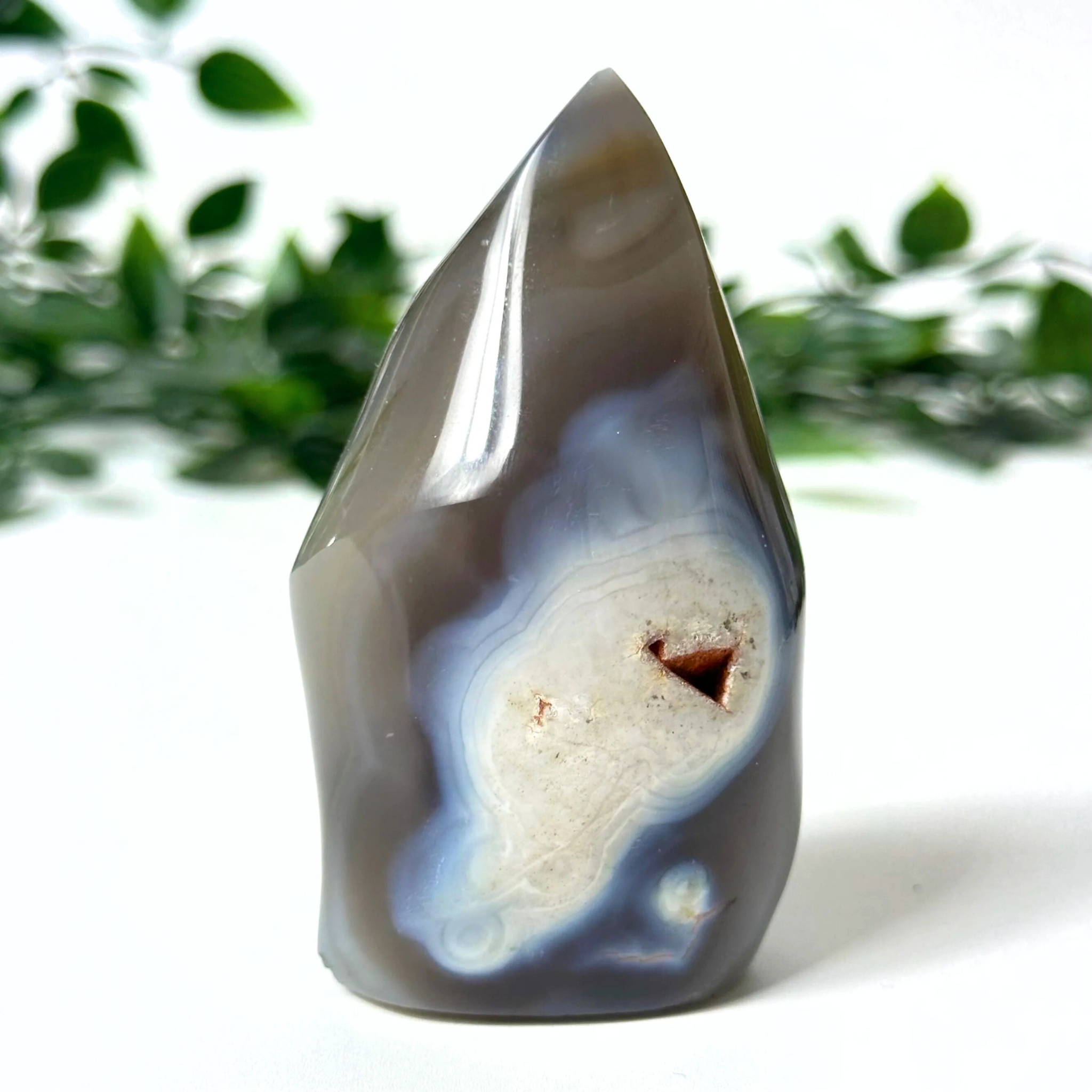 Orca agate flame with a natural pattern on a white background