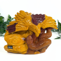 Decorative Mookaite eagle and snake carving with yellow and brown colors on a white background